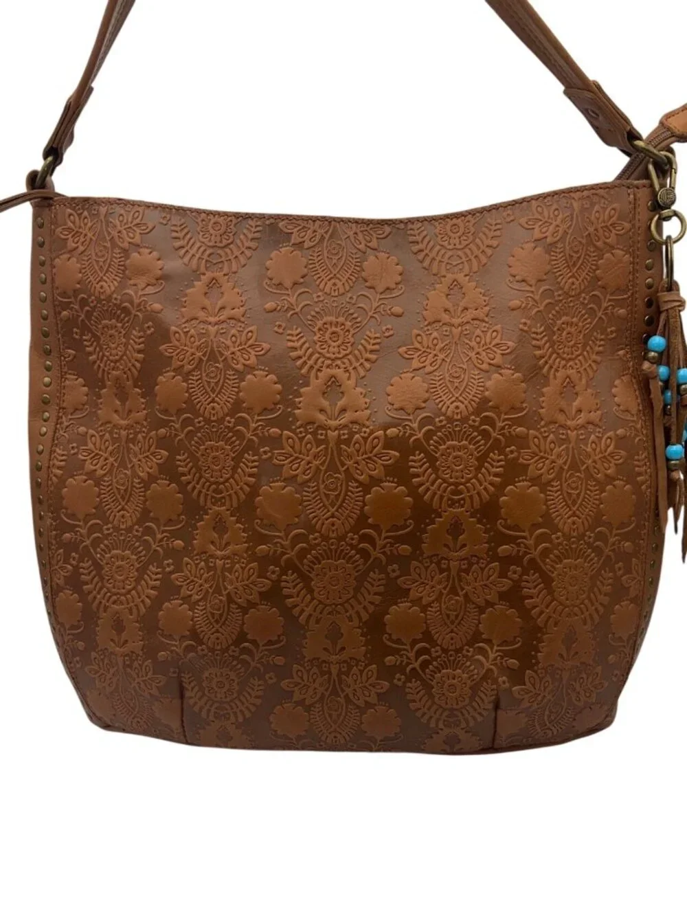 The Sak Leather Hobo Indio Floral Tooled Slouchy Tan Shoulder Bag Tassel Charm